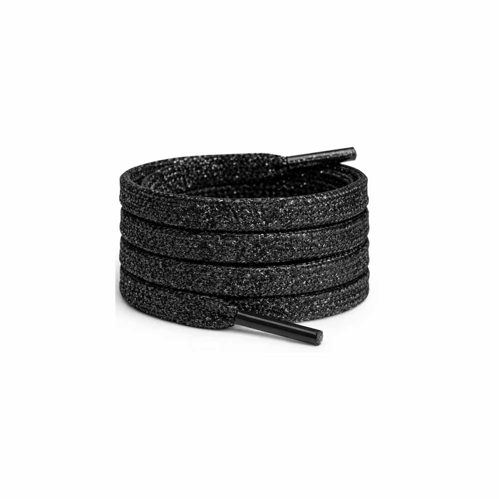 skosnoeren glitter svarta platta